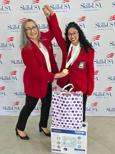 Yasdierys Hernández with Professor Lilliam Cordero after earning first place in SkillsUSA.
