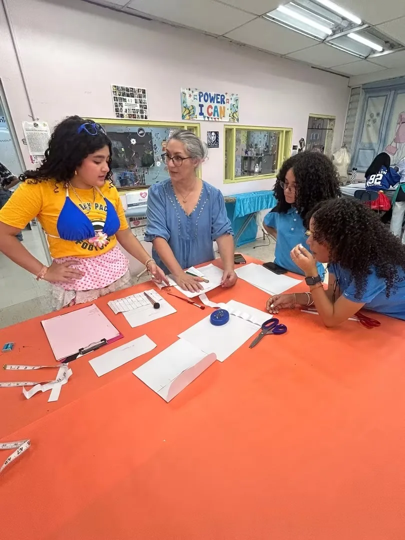 Professor Lilliam Cordero with High Fashion students