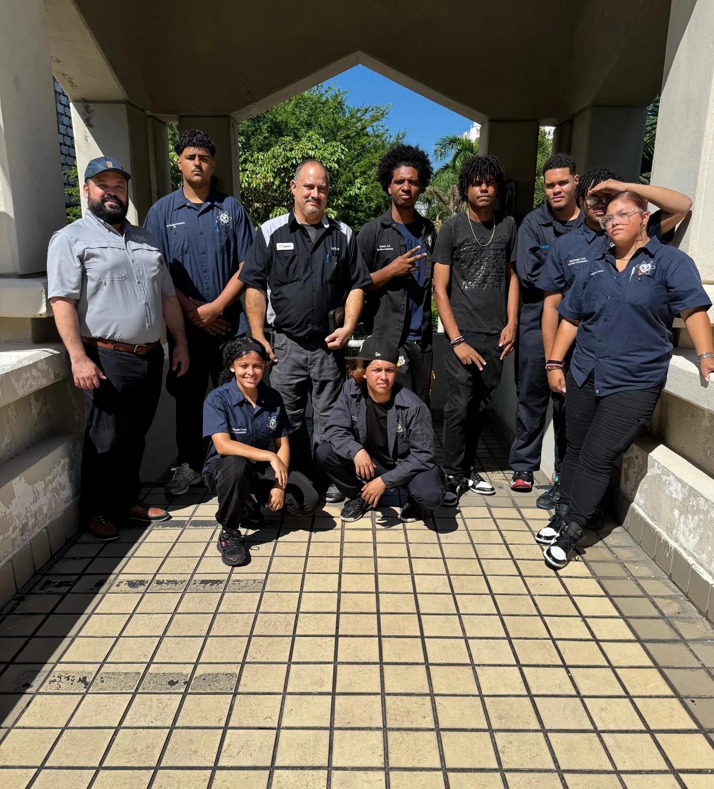 Professor Eligio Cristóbal with Automotive Technology students