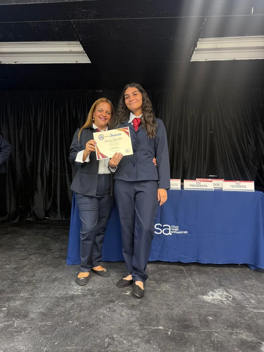 Professor Yokasta Guzmán during a HOSA recognition